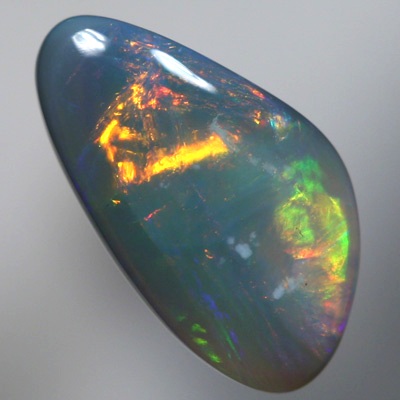 SOLID SEMI BLACK OPAL Large rolling flashes of reds, oranges over blue, purple